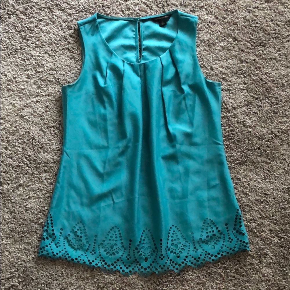 Laser cut sleeveless teal blouse